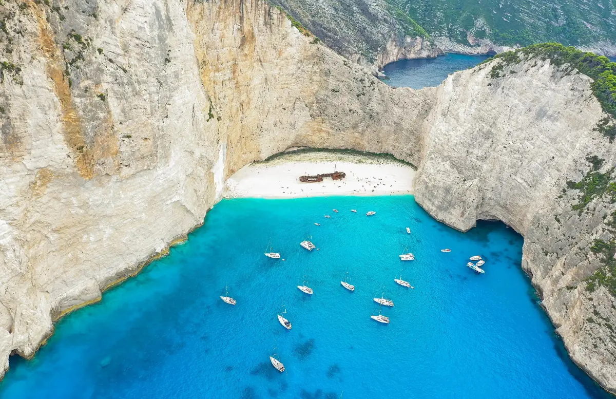 Boats anchored in Navagio bay seen from above