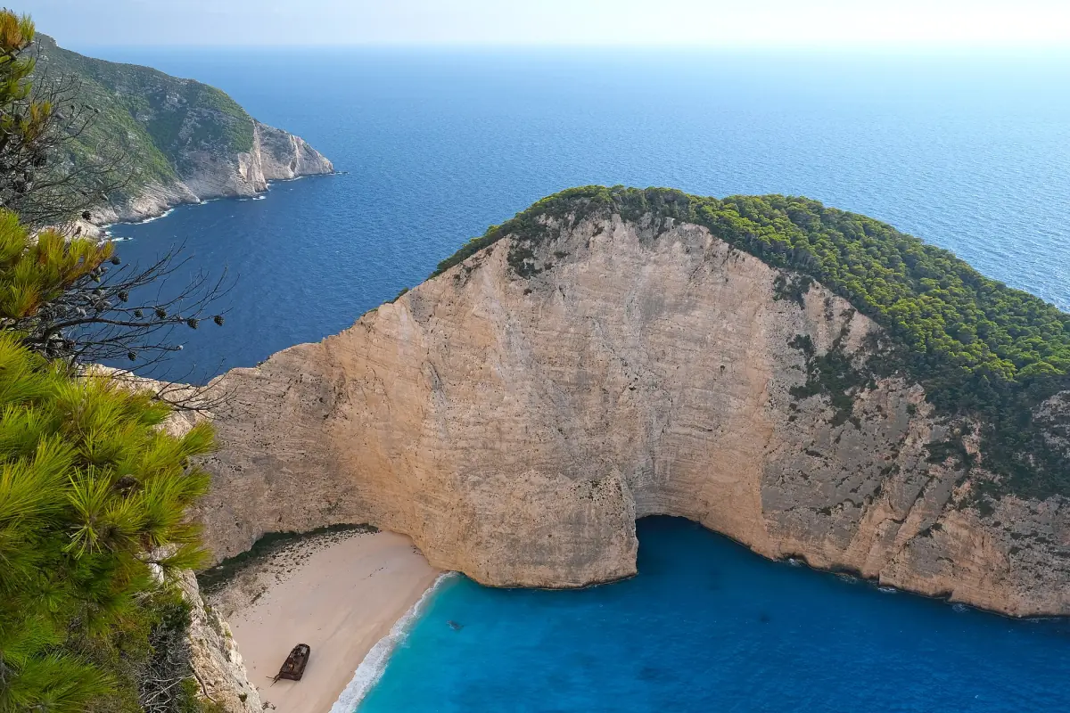 Navagio bay with its white beach and turquoise water from above