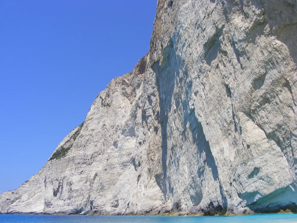 The steep limestone cliff above the bay