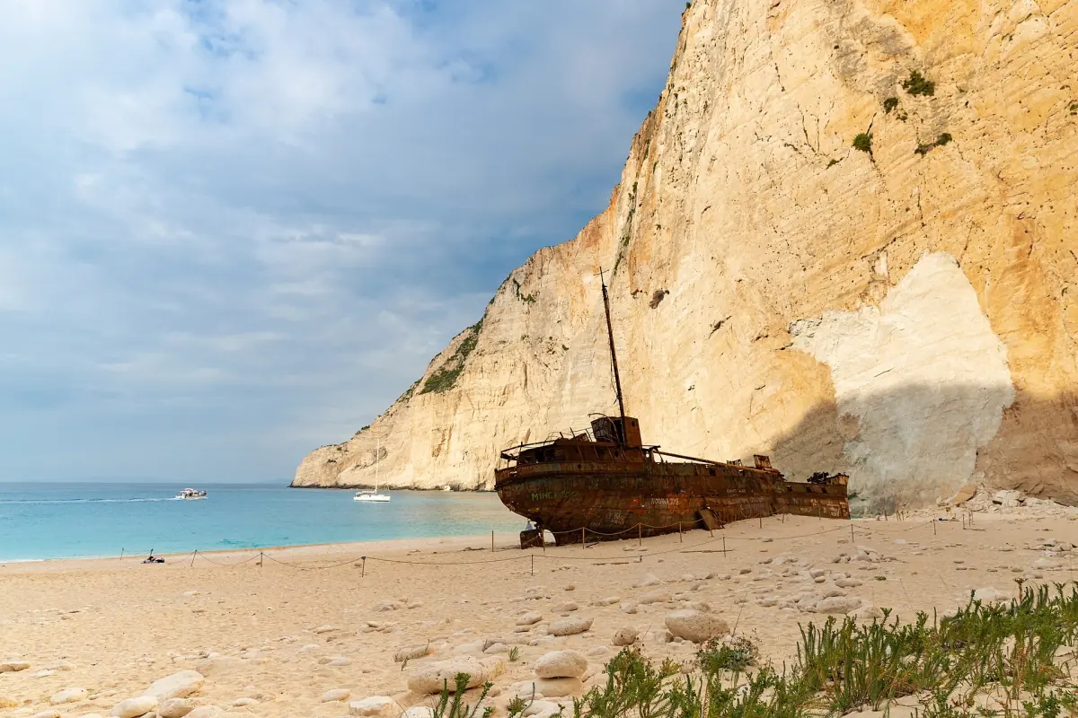 The shipwreck on the beach with the cliff behind