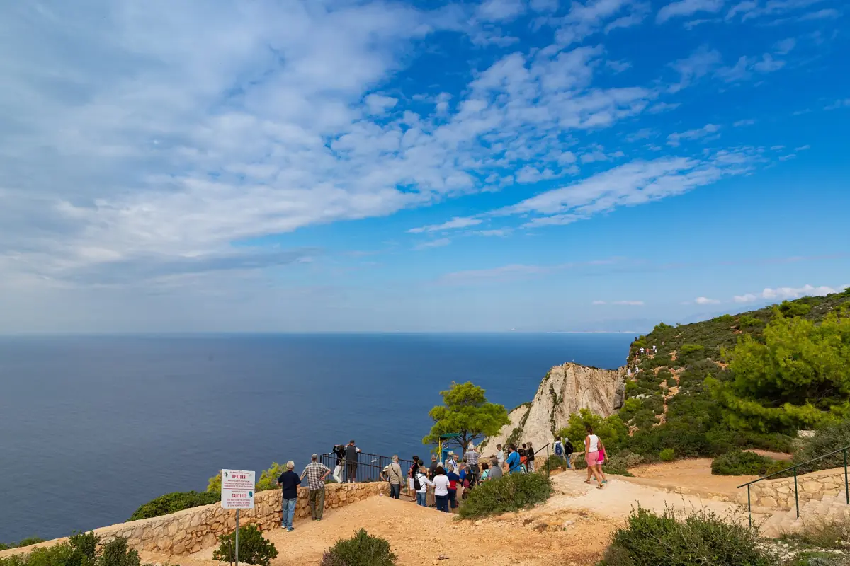 Visitors at the viewpoint above Navagio
