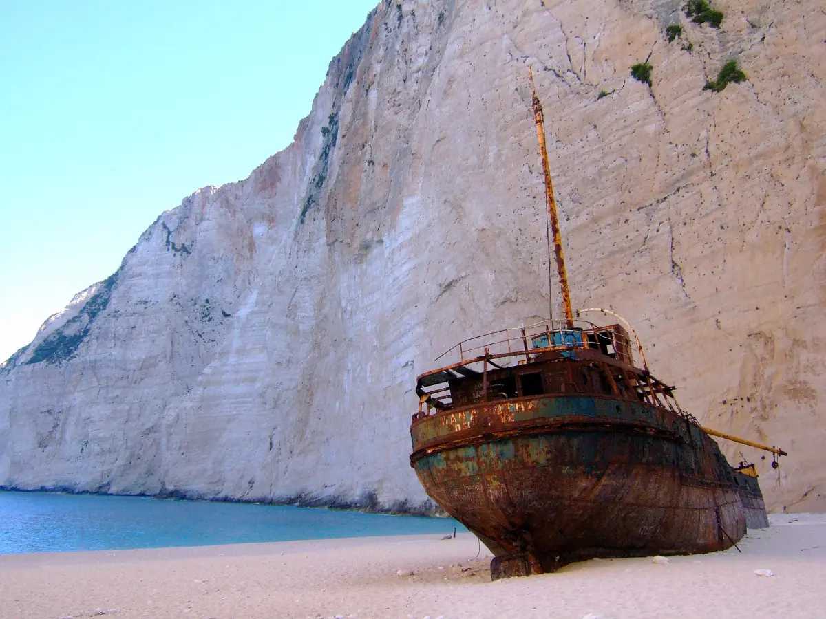 The rusting wreck of the Panagiotis below the cliff